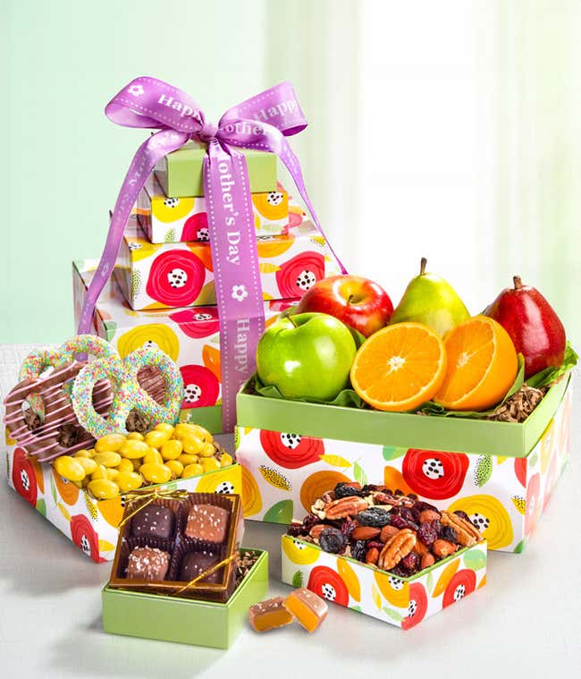 Mother's Day Gift Basket: Green D'Anjou Pear, Red D'Anjou Pear, Navel Orange, Braeburn Apple, Granny Smith Apple, Gourmet Brownies, Cherry Berry Trail Mix, Lemon Cr&egrave;me Almonds, Milk &amp; Dark Chocolate Sea Salt Caramels. Adorned with a 