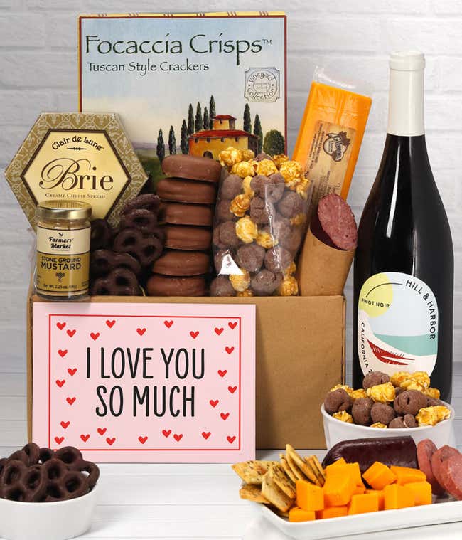 A gift featuring Hill &amp; Harbor Pinot Noir, smoky sharp cheddar, Brie cheese, focaccia crisps, summer sausage, stone-ground mustard, chocolate-covered pretzels, chocolate-dipped cookies, caramel popcorn, and an 'I Love You So Much' message.
