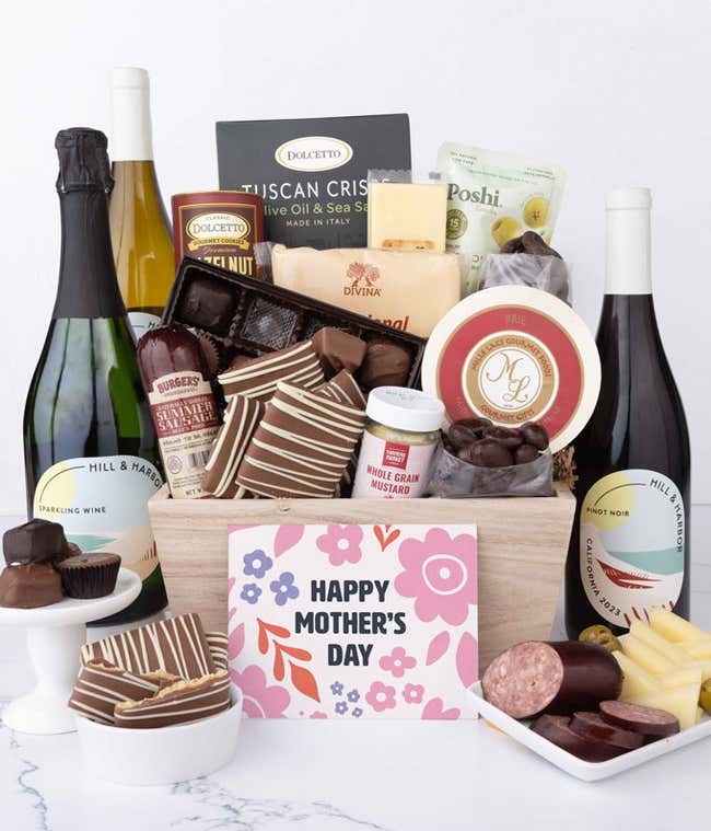 Wooden Mother&rsquo;s Day gift crate filled with three bottles of Hill &amp; Harbor wine, summer sausage, brie, cheeses, Tuscan crisps, chocolates, pretzels, and gourmet snacks, displayed with a Mother&rsquo;s Day card.